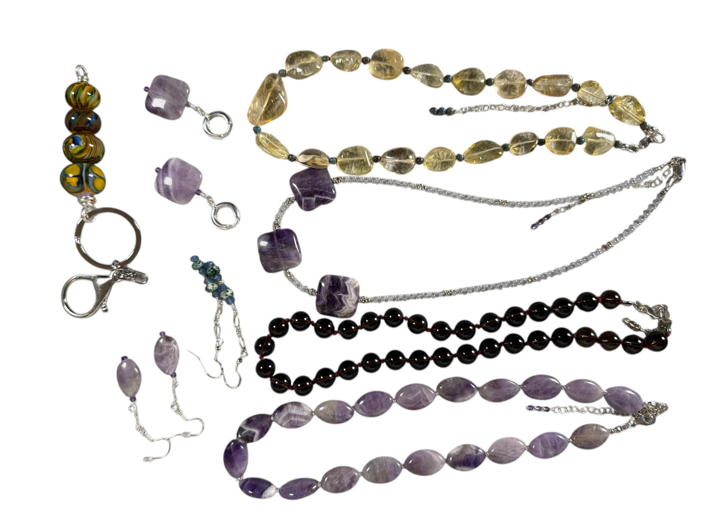 #144-Amethyst Earrings on SS Huggie